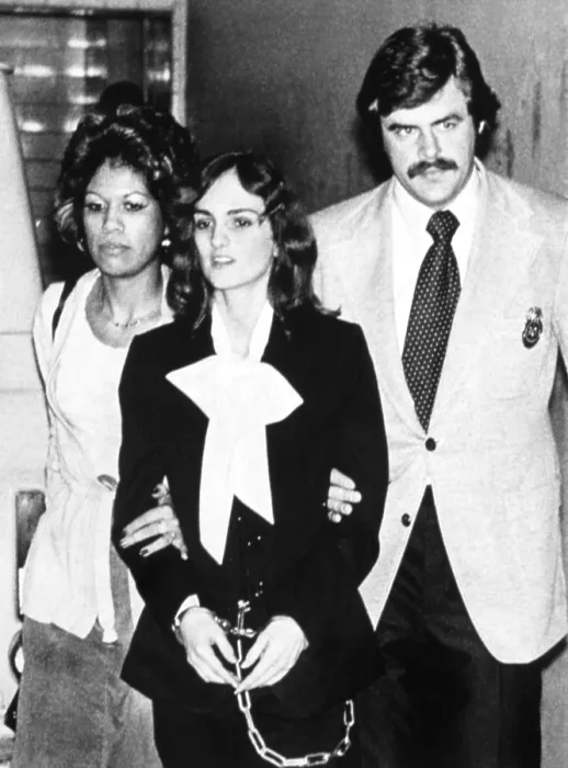 Framed Print : Patricia Hearst being lead from Federal Building in San Francisco, CA, by U.S. Marshals during her trial, 02 / 06 / 76.. Courtesy: CSU Archives  /  Everett Collection