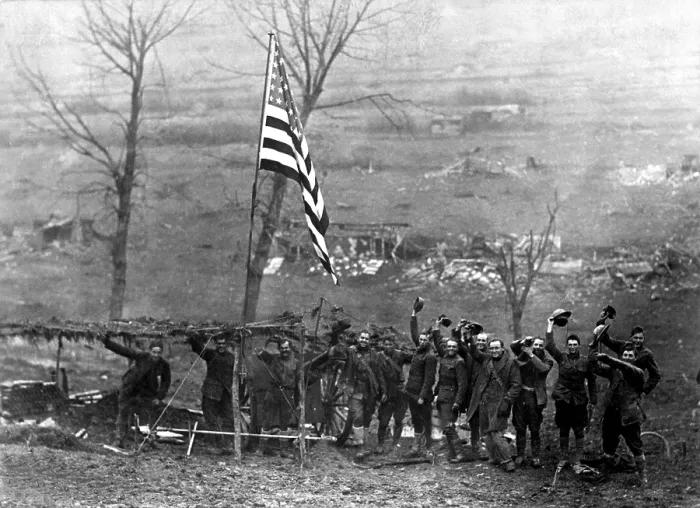Framed Print : Peace celebration on the battlefield. An American flag was hoisted by the U.S. 105th Field Artillery, when the armistice went into effect. Etraye, France. World War I. Nov