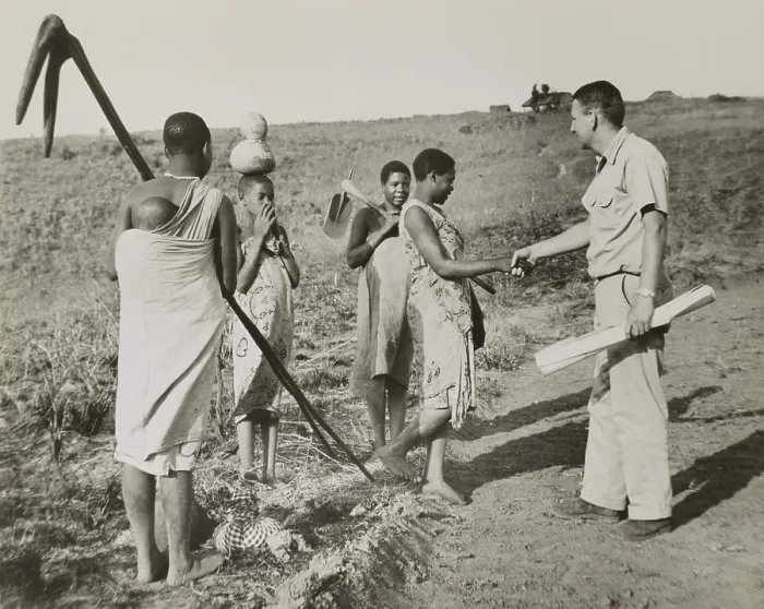 Framed Print : Peace Corps volunteer meeting four village women working in fields, Tanganyika, Oct. 17, 1962