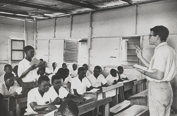 Framed Print : Peace Corpsman teaches English in Ghana. The students are all young men or teenagers in a simple schoolhouse. April 18, 1962. (BSLOC_2015_2_230)