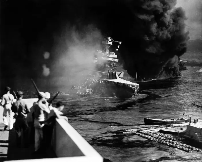 Framed Print : Pearl Harbor: Battered by aerial bombs and torpedoes, the U.S.S. California is evacuated as sailors and soldiers look on, December 7, 1941