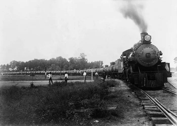 Framed Print : Pedestrians waiting at a railroad crossing for Louisiana Arkansas Railroad train pulling tank cars to pass. Ca. 1920-1940. LC-USZ62-106094 Framed Print : Pedestrians waiting at a railroad crossing for Louisiana Arkansas Railroad train pulling tank cars to pass. Ca. 1920-1940. LC-USZ62-106094