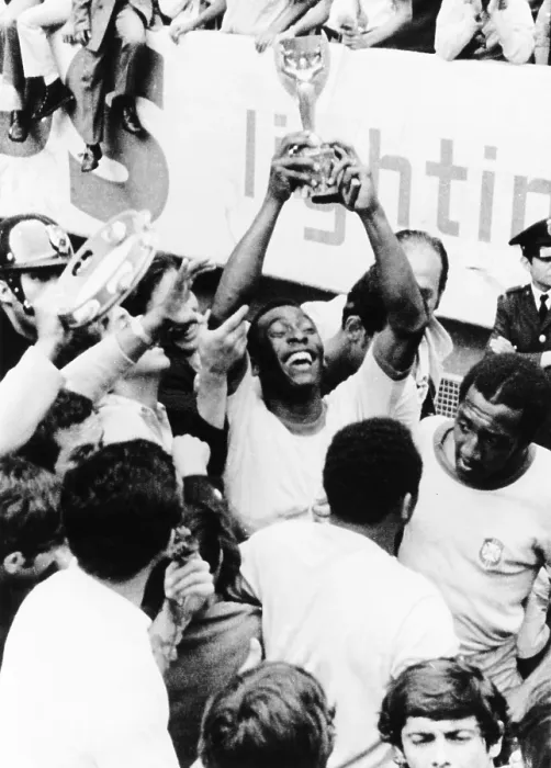 Framed Print : Pele in triumph in Mexico City, June 21, 1970. He holds up the Jules Rimet Cup, won by Brazil for defeating Italy 4-1 in the final World Cup game