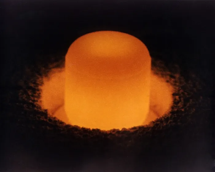 Framed Print : Pellet of Plutonium-238 glowing from its own heat. Plutonium-238 is used to fuel space probes as a sustained power source for a long voyages with little weight or mass
