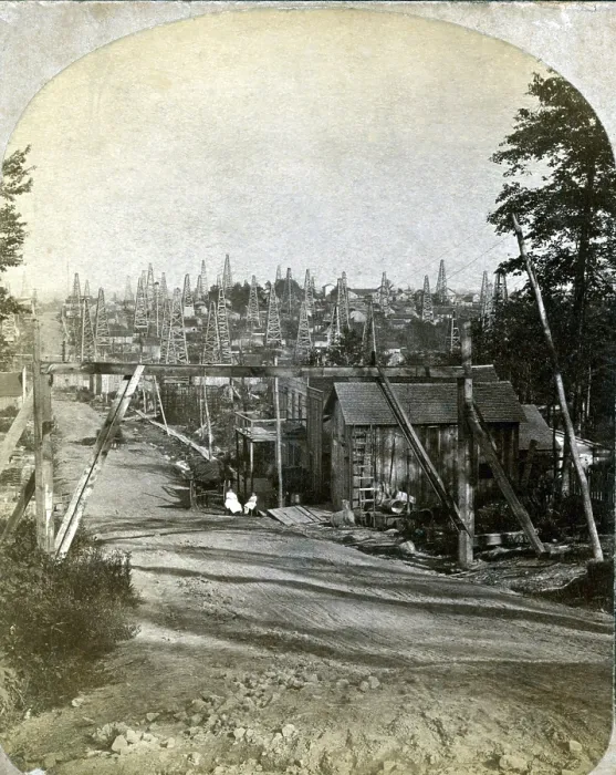 Framed Print : The Pennsylvania oil region. West side of Triumph Hill, near Tidioute, Pennsylvania with buildings, storage tanks, and derricks. 1875
