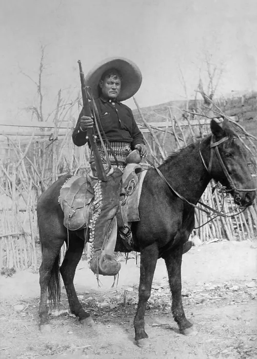 Framed Print : Peon rebel volunteer mounted on a small horse, in the Mexican Revolution, c. 1910-1919. Equipped with a rifle, he wears buckled chaps and a wide sombrero (BSLOC_2016_13_60.jpg ) Framed Print : Peon rebel volunteer mounted on a small horse, in the Mexican Revolution, c. 1910-1919. Equipped with a rifle, he wears buckled chaps and a wide sombrero (BSLOC_2016_13_60.jpg )