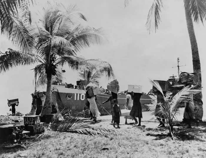 Framed Print : People of Bikini Atoll carry their belongings down to boat. 40 families were temporarily moved to Rongerik Atoll on March 7, 1946