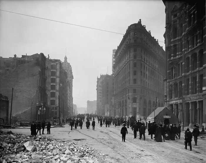 Framed Print : People walking on Market St. after the April 18, 1906 San Francisco earthquake and 3-day fire. Note the tent housing emergency operations of the Postal Telegraph Co