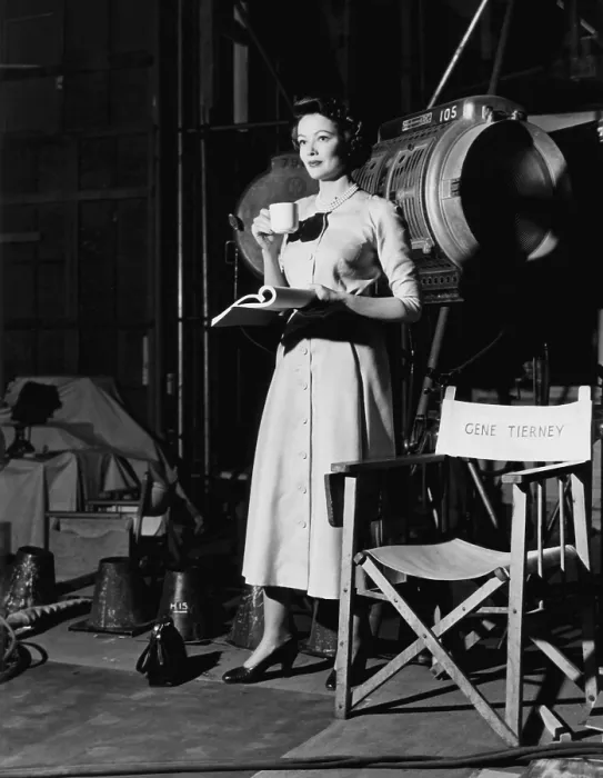 Framed Print : PERSONAL AFFAIR, Gene Tierney holding her script and afternoon tea on set, 1953