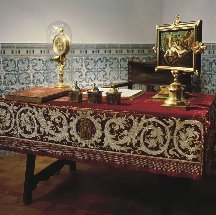 Framed Print : PHILIP II of Spain (1527-1598). Desk of Philip II. A painting of the martyrdom of Saint Lawrence (Florentine School) and a Hans de Evalo's clock stand out on the table (1583)