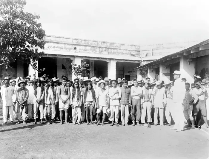 Framed Print : The Philippine-American War. Philipino prisoners of war, posed in courtyard. ca. 1899