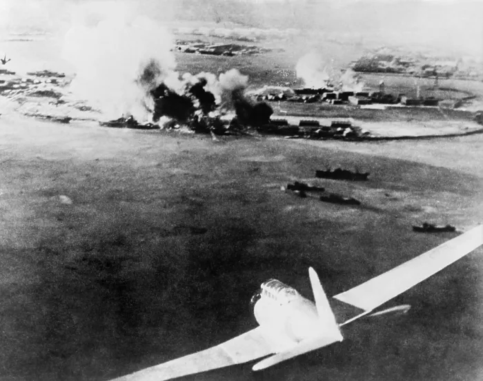 Framed Print : Photograph taken by a Japanese pilot, of the destruction of Pearl Harbor. At lower right is a Japanese bomber. Dec. 7, 1941. (BSLOC_2013_11_137)