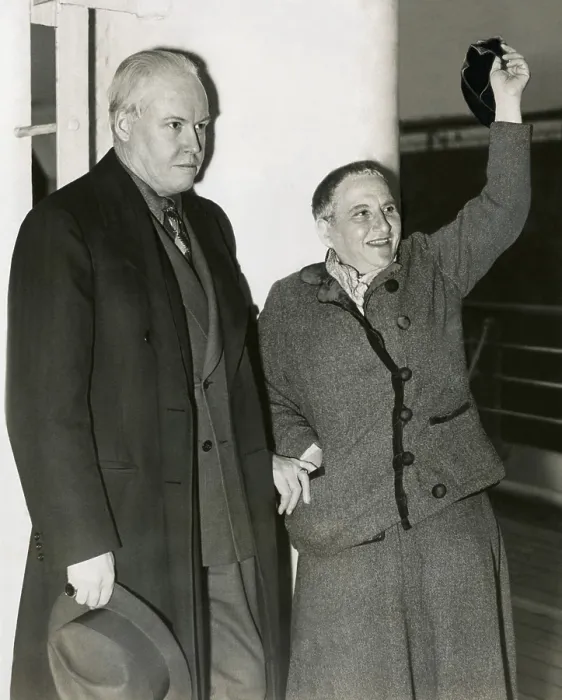 Framed Print : Photographer Carl Van Vechten with Gertrude Stein as she waves her hat from S.S. Champlain. May 4, 1935. Stein had been part of the expatriate art community is Paris for decades
