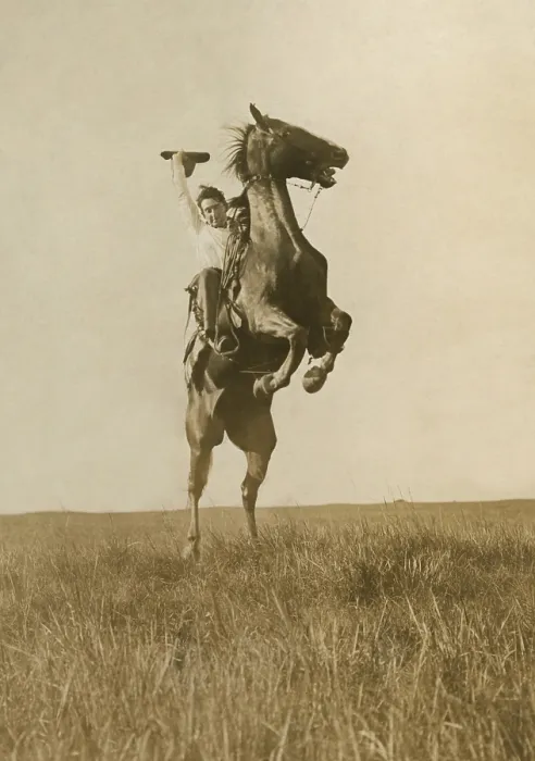 Framed Print : Photographer Erwin E. Smith Riding a sunfisher, and he is not pulling leather, in Texas, 1908. A sunfisher is bucking horse that twists his body in the shape of a crescent