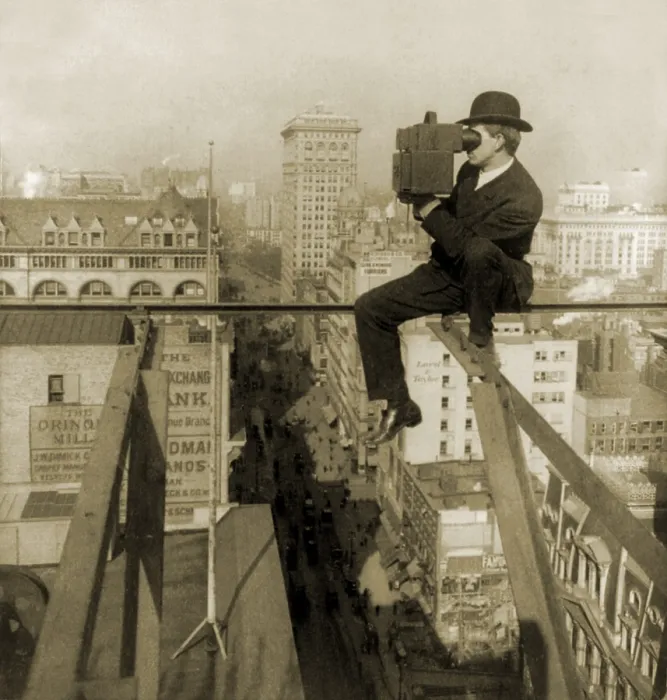 Framed Print : Photographer perched on slender beam 18 stories above pavement of Fifth Avenue, New York City. 1907 Framed Print : Photographer perched on slender beam 18 stories above pavement of Fifth Avenue, New York City. 1907