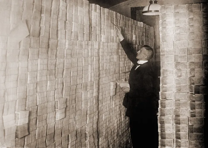 Framed Print : Piles of German money in a Berlin bank during the post-World War I hyper-inflation. In 1923 an American dollar was worth 800 million German marks Framed Print : Piles of German money in a Berlin bank during the post-World War I hyper-inflation. In 1923 an American dollar was worth 800 million German marks