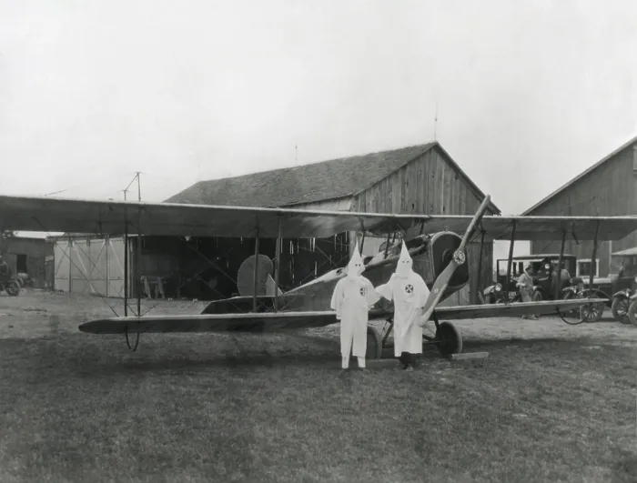 Framed Print : Two pilots in Ku Klux Klan shrouds pose with their aircraft in Dayton, Ohio in 1924. (BSLOC_2015_16_175)