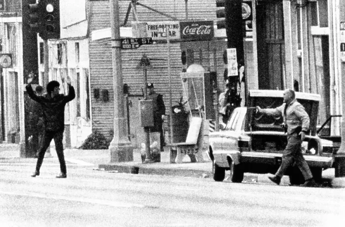 Framed Print : A plainclothes policemen arrests an African American leaving Los Angeles Black Panther headquarters Framed Print : A plainclothes policemen arrests an African American leaving Los Angeles Black Panther headquarters