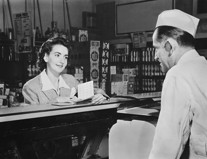 Framed Print : How many points will it take?, a shopper asks before she buys food during World War 2 Framed Print : How many points will it take?, a shopper asks before she buys food during World War 2