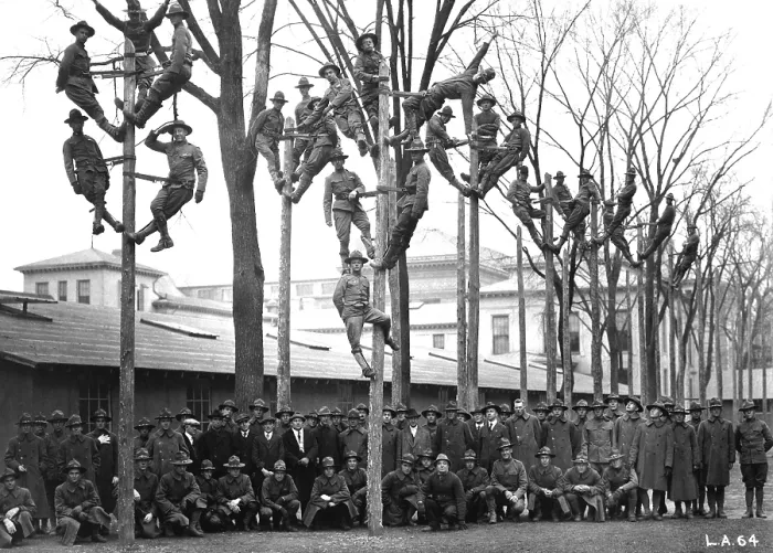 Framed Print : Pole-Climbing training for Students Army Training Corps at the University of Michigan. The uniformed students are in a course for telephone electricians. World War I. Ca. 1918
