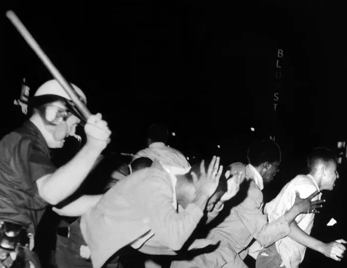 Framed Print : Police club demonstrators in Harlem on July 20, 1964. They were protesting the fatal police shooting of 15 year old James Powell four days earlier