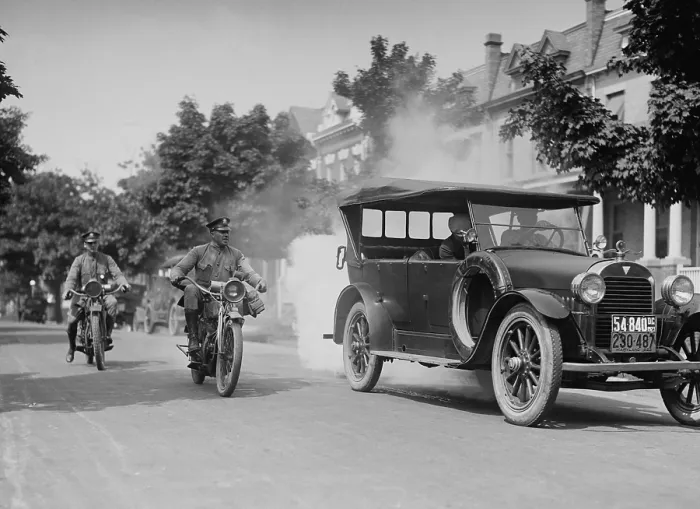 Framed Print : Police on motorcycles trailing a car with heavy smoke exhaust, Washington, D.C. Sept. 1, 1923 (BSLOC_2016_10_126)
