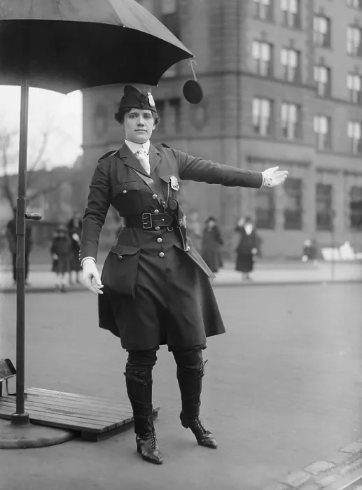 Framed Print : Policewoman directing traffic in Washington, D.C. in 1918. Her progressive uniform combines knee high boots, below knee pants, and a knee length jacket
