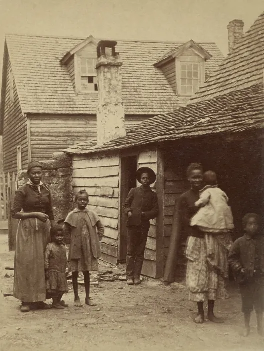 Framed Print : Portrait of an African American family standing in front of a house, St. Augustine, Florida, 1886. Photo by George Barker (BSLOC_2017_20_124)