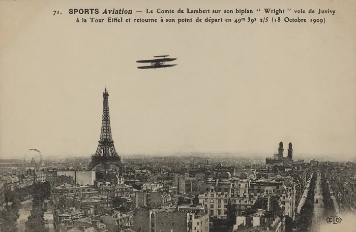 Framed Print : Postcard shows the Wright biplane flown by Charles, Comte de Lambert flying over Paris; with the Eiffel Tower in the background. Ca. 1910 Framed Print : Postcard shows the Wright biplane flown by Charles, Comte de Lambert flying over Paris; with the Eiffel Tower in the background. Ca. 1910