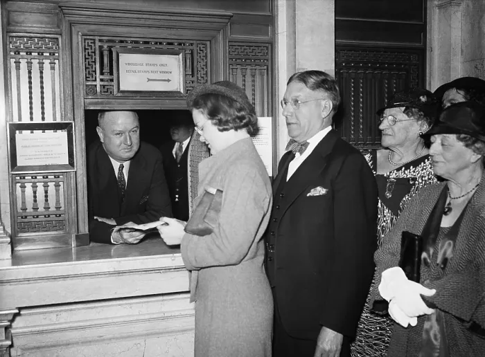 Framed Print : Postmaster James Farley at Post Office service window. 1934. FDR appointed Farley Postmaster General, a post traditionally given to campaign managers or influential supporters