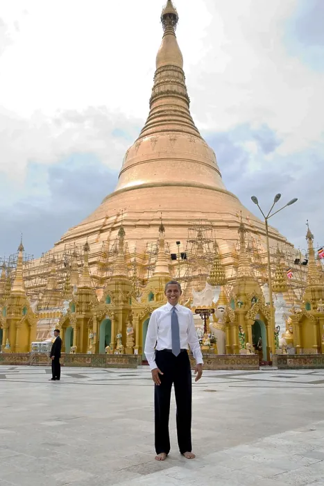 Framed Print : President Barack Obama with bare feet in front of the Shwedagon Pagoda. All visitors must remove their shoes and socks while touring the pagoda