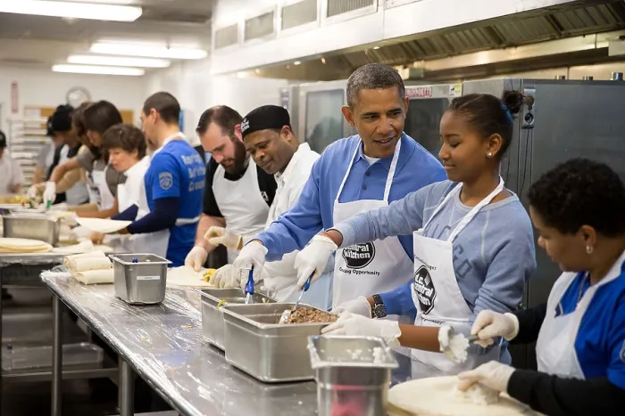 Framed Print : President Barack Obama and his daughter Sasha assemble burritos at DC Central Kitchen. It was a Martin Luther King, Jr. Day of Service event in Washington, D.C. Jan. 20, 2014
