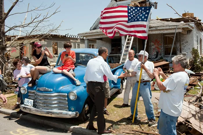 Framed Print : President Barack Obama greets Hugh Hills, 85, in front of his home in Joplin, Mo. May 29, 2011