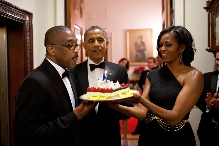 Framed Print : President Barack Obama and Michelle Obama present a birthday cake to Assistant Usher Reggie Dickson. June 13, 2012. (BSLOC_2015_13_209)