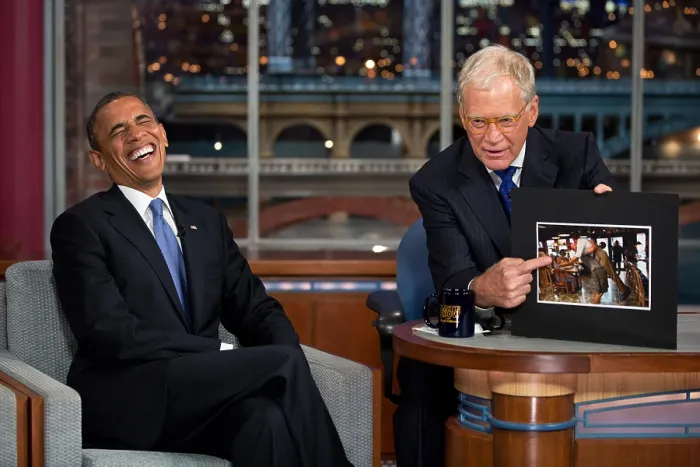 Framed Print : President Barack Obama reacts to a photograph while taping of Late Show with David Letterman'. Sept. 18, 2012. (BSLOC_2015_3_110)