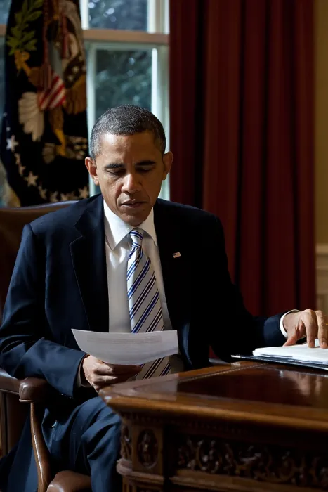 Framed Print : President Barack Obama reads a document in the Oval Office, Feb. 21, 2012. (BSLOC_2015_3_3) Framed Print : President Barack Obama reads a document in the Oval Office, Feb. 21, 2012. (BSLOC_2015_3_3)