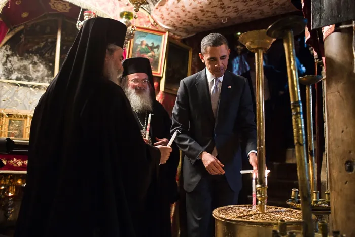 Framed Print : President Barack Obama visits the Church of the Nativity in Bethlehem, the West Bank, Palestine. He lights candles with Greek Orthodox priests. (BSLOC_2015_3_193)