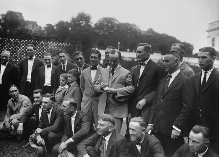 Framed Print : President Calvin Coolidge autographing a baseball for star pitcher, Walter Johnson. Sept. 5, 1924