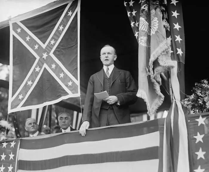 Framed Print : President Calvin Coolidge speaking beside Confederate flag at Arlington Cemetery. May 24, 1924. (BSLOC_2015_15_126)