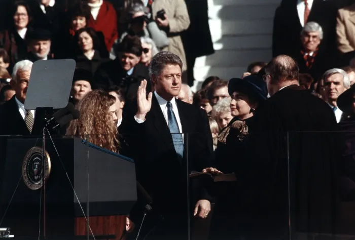 Framed Print : President Bill Clinton takes the oath of office administered by Chief Justice William Rehnquist. Wife Hillary Rodham Clinton and daughter Chelsea Clinton look on. Jan. 20, 1993