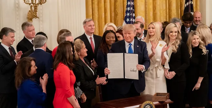 Framed Print : President Donald Trump displays his signature on an Executive Order for Combating Human Trafficking and Online Child Exploitation, Jan. 31, 2020