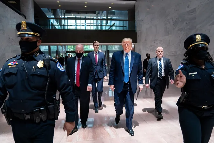 Framed Print : President Donald Trump is escorted by Capital police as he arrives with staff for a Senate Republican election policy luncheon, May 19, 2020 (BSLOC_2020_4_42)
