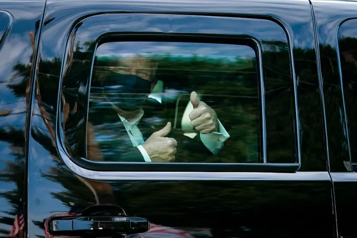 Framed Print : President Donald Trump gestures thumbs up to his supporters during a drive outside of Walter Reed Medical Center during his hospitalization for a COVID-19 disease on, Oct
