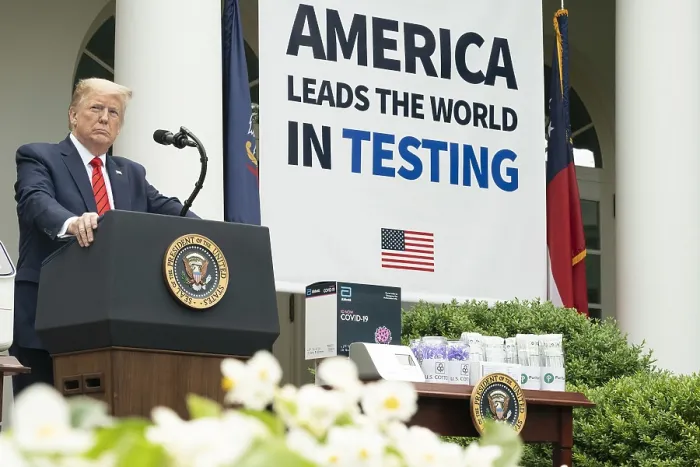 Framed Print : President Donald Trump stands beside a large sign proclaiming, AMERICA LEADS THE WORLD IN TESTING Framed Print : President Donald Trump stands beside a large sign proclaiming, AMERICA LEADS THE WORLD IN TESTING