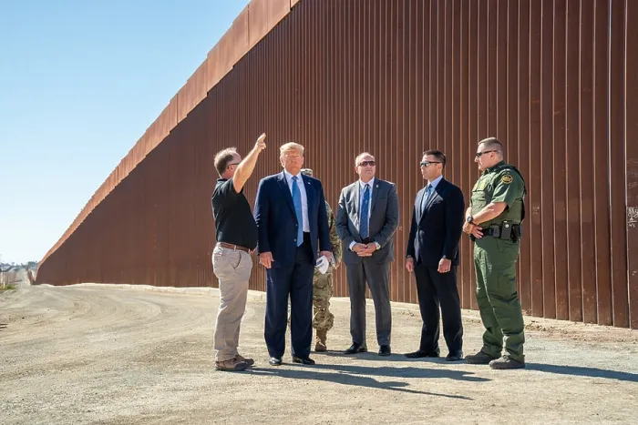 Framed Print : President Donald Trump, visits a walled section of the US-Mexico border at Otay Mesa, a neighborhood along the Mexican border in San Diego, Calif. Wednesday, Sept