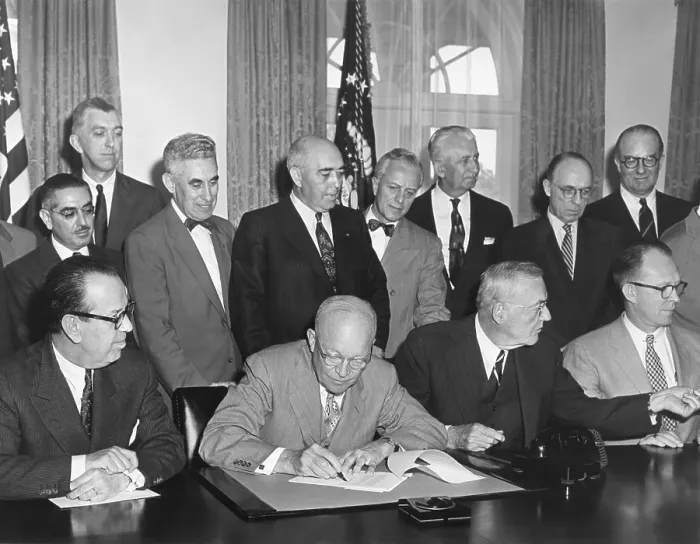 Framed Print : President Eisenhower initialing the first agreement for the Peaceful use of Atomic Energy. May 3, 1955