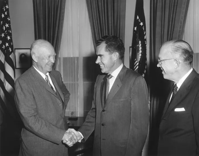 Framed Print : President Eisenhower shaking Richard Nixon's hand on his return from the USSR. He was accompanied by the President's brother, Milton (right). Aug. 5, 1959