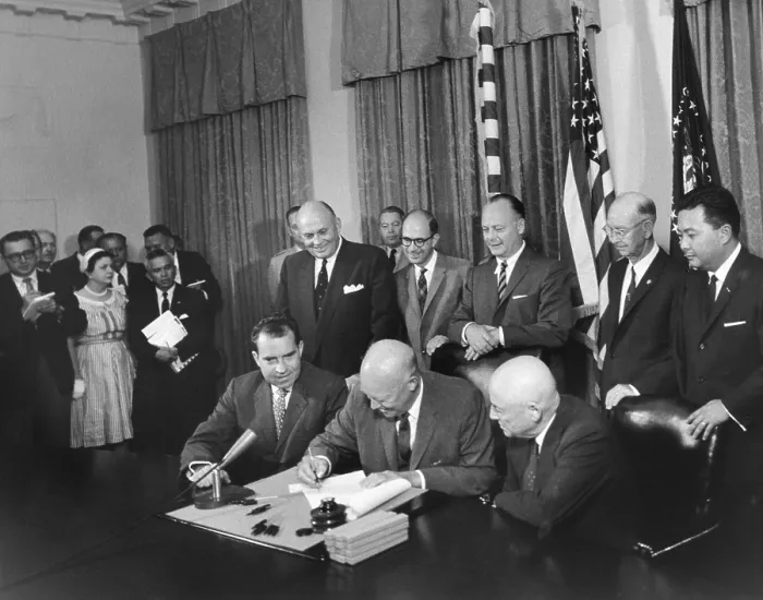 Framed Print : President Eisenhower signing a proclamation formally admitting Hawaii as the 50th state. Aug. 21, 1959. Vice President Nixon and Sam Raeburn also signed