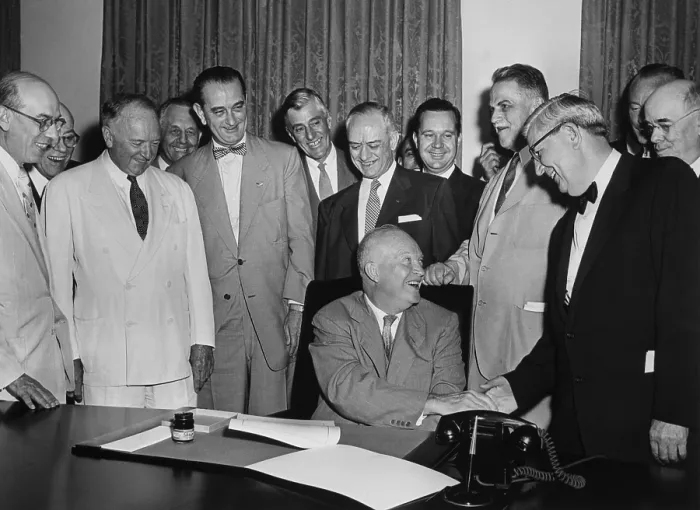 Framed Print : President Eisenhower signs a bill as Senate Majority Leader, Lyndon Johnson, and others look on. Johnson is fifth from left with the bow tie. June 1955