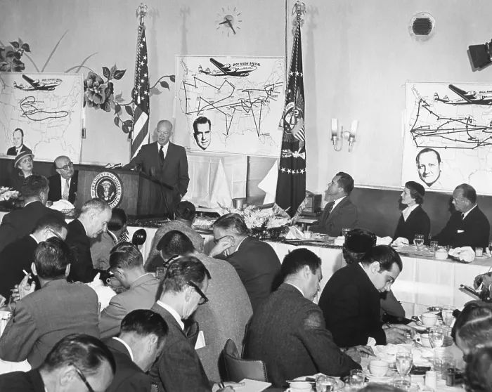 Framed Print : President Eisenhower speaking at a Republican Campaign Kick-off breakfast for VP Richard Nixon. Behind the President, is a map of Nixon's extended campaign trip. Sept